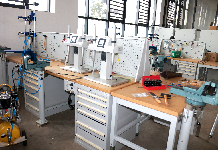 Fabrication workbenches with bench drills, vices and hand tools