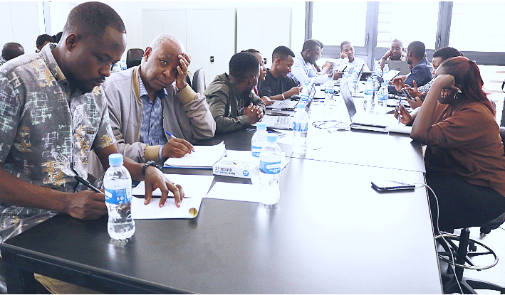 Participants taking notes during a case study